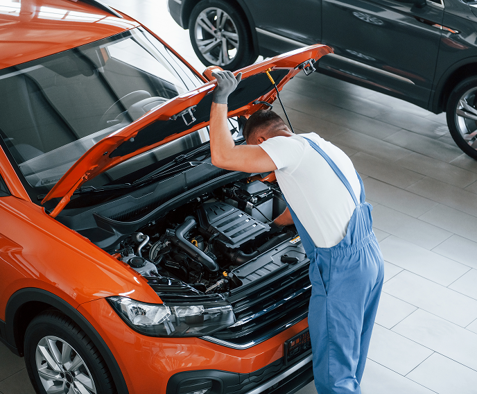 Technician performing engine repair